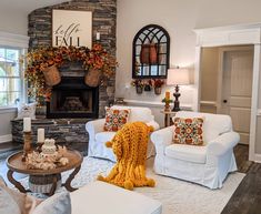 a living room filled with furniture and a fire place