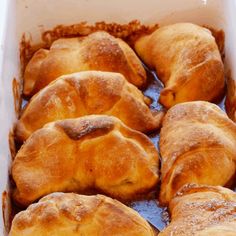 baked pastries sitting in a baking dish ready to be eaten