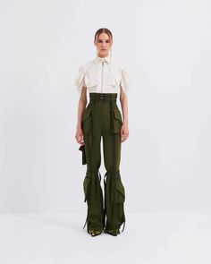 High waisted cargo pants features multi pockets and metal loop accessories. It fastens with a front zip closure. High Waisted Cargo Pants, Matching Sets Outfit, Maxi Tops, Summer Party Dress, Swimwear Sale, Embellished Dress, Swimwear Tops, Bra Tops, Jacket Tops