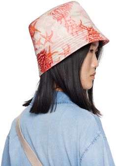 Polyester twill bucket hat in pink and red. · Graphic pattern printed throughout · Quilted brim · Cotton poplin lining Supplier color: Pink/Print Pink Flat Brim Bucket Hat, Pink Reversible Bucket Hat With Curved Brim, Reversible Wide Brim Bucket Hat, D Rose, Versace Pink, Pink And Red, Graphic Patterns, Pink Print, Cotton Poplin