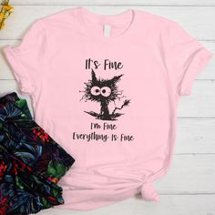 I'm Fine Everything Fine Shirt, Funny Cat Shirt, Sarcasm gift T-shirt, Snarky Shirt,  Gift for Her Funny Tee, Cat Lover Shirt. Our personalized t-shirts are made from high-quality materials that feels great against your skin. With a range of colors and designs to choose from, you're sure to find a shirt that matches your personality and style. Whether you're looking for a funny graphic tee, a statement piece with bold, eye-catching artwork, or a classic design with a twist, we have something for Funny Short Sleeve T-shirt With Cat Design, Funny Cat Print Short Sleeve Tops, Funny Cat Print Crew Neck T-shirt, Cotton T-shirt With Cat Design For Gift, Cotton T-shirt With Cat Design As Gift, Casual Cat Design T-shirt As Gift, Casual T-shirt With Cat Design For Gift, Casual T-shirt With Cat Design As Gift, Crew Neck Top With Cat Design For Gift