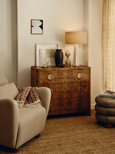 a living room scene with focus on the chair and side table in the foreground