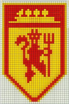 a cross stitch pattern with a red and yellow shield on it's side,