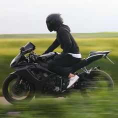 a person riding on the back of a motorcycle