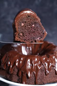 a chocolate bundt cake on a plate with a knife