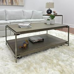 a coffee table sitting on top of a white rug