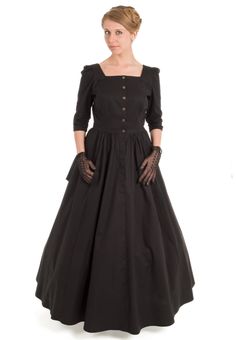 Pretty Victorian style cotton dress combines femininity and functionality in its fitted bodice, square neckline in front and back, long 3-gored skirt gathered to the waist, and 3/4 length sleeves. Metal buttons close the front. An attached cascading half-skirt in back adds a bit of a bustle flare to the dress. Hand or machine wash, tumble dry low or air dry. The model is wearing a crinoline and boots and they are priced separately. Recollections clothing is made in America. The following are app Square Neck Midi Dress With Buttons For Daywear, Elegant Cotton Dress With Button Cuffs, Elegant Cotton Midi Dress With Gathered Skirt, Fall Dresses With Gathered Skirt, Long Sleeve Dress With Gathered Skirt, Square Neck Dress With Gathered Sleeves For Work, Fitted Victorian Dress With Buttons, Square Neck Dresses With Gathered Sleeves For Work, Fitted Prairie Dress With Gathered Sleeves