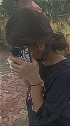 a woman taking a photo with her cell phone