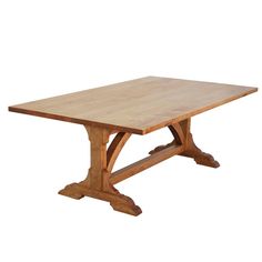 a wooden table sitting on top of a white floor