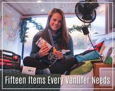 a woman sitting on top of a bed holding an item in her hands with the words fifteen items every vanity needs