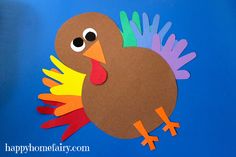 a paper turkey on a blue background