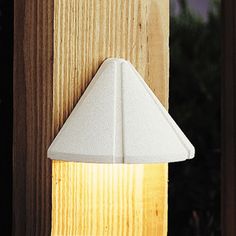 a light that is on the side of a wooden pole