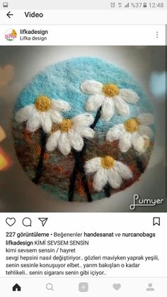 an image of a cake decorated with daisies on the top and bottom, as well as words below