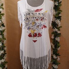 Flattering Fit With Fringe Detail Hd Tunic T-Shirt. Unique Graphics With Crystal Bead Embellished Letters. The Fringe Moves When You Walk & Ride. This One Will Get You Noticed With Compliments. Retired Style. Nwot. New Condition, Never Worn Size Large Red Fringe Tops For Summer, White Cotton Fringe Tops, Spring Embellished Red Tops, Fitted White Tops With Fringe, White Fitted Fringe Tops, Embellished Red Tops For Spring, Red Embellished Tops For Spring, Bohemian Embellished Short Sleeve Tops, Embellished Letters