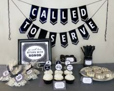 a table topped with cupcakes and desserts