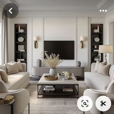 a living room filled with white furniture and lots of windows