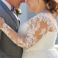 the bride and groom are embracing each other