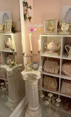 there are many items on the shelves in this room, including candles and teapots