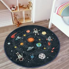 a child's room with a rug that has space and stars on it