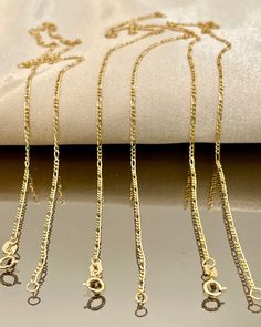 18 KARAT GOLD FIGARO NECKLACE CHAIN(1.6mm)THICK 16"18"LENGTH (1.33gr1.47gr)WEIGHT  SOLID GOLD,YELLOW GOLD NECKLACE CHAIN [Please text me if you want specific length or width i can customize it for you.] Price to sell! Compare our price to other similar sellers! Arrives in a GIFT BOX and includes FREE SHIPPING within the USA and CANADA. international shipping is available at the most economical rates on ETSY. I HAVE BEEN IN THE JEWELRY BUSINESS ALL MY LIFE I am second generation family member mak Men's Necklace Gold, Gold Necklace For Men, Real Gold Chains, Mens Cross Necklace, Figaro Necklace, Gold Jewelry Gift, Best Gifts For Him, Real Gold Jewelry, Gifts For Fiance