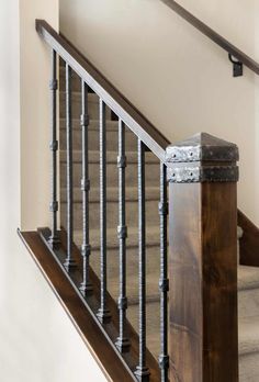 an iron and wood stair railing in a home