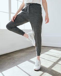 Our favorite performance joggers are a slim fit with the perfect amount of stretch for ultimate comfort. Thick drawstrings, cuffed ankles, and two pocket design give them a premium feel. Our Flowknit fabric is made from Global Recycle Standard poly yarn, which diverts and recycles plastics destined for landfill or the ocean, so you can feel and look good in what you wear.  | Quince | Women's Super Soft Performance Joggers in Heather Grey, Flowknit Activewear, Size Small, Recycled Polyester Athleisure Joggers With Stretch And Functional Drawstring, Stretch Athleisure Joggers With Functional Drawstring, Athleisure Drawstring Sweatpants For Workout, Athleisure Sweatpants With Drawstring For Workout, Solid Color Activewear With Drawstring For Jogging, Athleisure Joggers With Functional Drawstring For Jogging, Stretch Sportswear Joggers With Drawstring, Stretch Activewear With Drawstring For Jogging, Athleisure Activewear With Drawstring