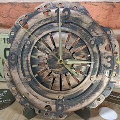 an old clock is sitting on a table