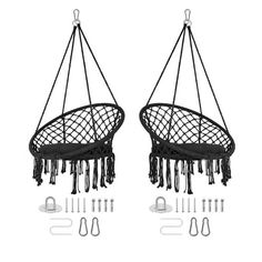 two black hanging chairs next to each other with scissors and pliers in front of them