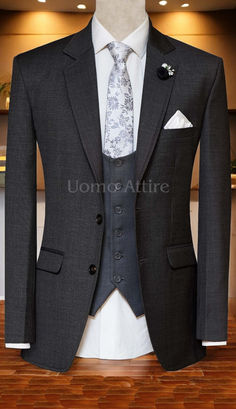 This charcoal grey wedding suit, crafted from premium Italian fabric, is the epitome of timeless elegance.  The slim-fit design flatters your figure, while the notch lapels, double vents, and single-breasted vest exude sophistication. ‍♂️

#weddingday #groomstyle #charcoalgreysuit #italiansuit #menswedding #weddingattire #groomtobe #weddingfashion #groomsgift #justmarried #mensfashion #dapper #weddingphotography #weddinginspiration #luxuryweddings Classic Gray Suit And Tie Accessories For Wedding, Gray Tuxedo With Suit Collar For Wedding, Gray Collared Tuxedo For Wedding, Gray Notch Lapel Tuxedo For Wedding, Gray Groom's Suit, Gray Tuxedo For Wedding, Fitted Gray Suit For Wedding, Gray Notch Lapel Blazer For Wedding, Classic Gray Suits For Wedding