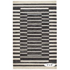 a black and white rug with stripes on it