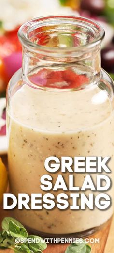 greek salad dressing in a jar on a cutting board