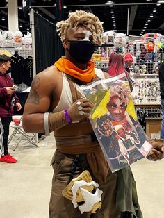 a man dressed up in costume and wearing a face mask holding a bag with an ad on it