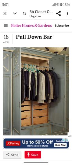 an image of a closet with clothes hanging on the rack and other items in it