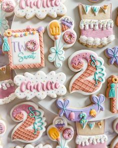 decorated cookies are displayed on a table