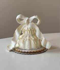 a white dress and bonnet on a table