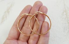 "14Kt real gold hoops earrings. Dainty 14kt hoop gold earrings. gold hammered huggies earrings. gift for her. 14kt texture elegant earrings Perfect hammered hoop for a different look. ♥ About The earrings: The hoops are made of 14k real gold. Wide 3.5 cm. (1.37\") Wide 3.4mm. Thickness 2mm. Shiny hammered finish. can be in yellow or white gold. Thank you for visiting my shop! Maya" Dainty 14k Gold Hammered Hoop Earrings, 14k Gold Hammered Hoop Earrings, Handmade 14k Gold Hoop Earrings For Everyday, Hammered Huggie Jewelry Gift, Handmade 14k Gold Hoop Earrings Gift, Handmade 14k Yellow Gold Hoop Earrings, Minimalist Diamond Cut Hoop Earrings Gift, Handmade 14k Gold Hoop Jewelry, Gift 14k Gold Filled Hammered Hoop Earrings