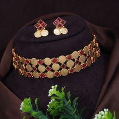 South Indian Necklace With Matte Gold Plating. Indian Bridal Traditional Jewelry Choker Set. Turn heads with this Laxmi long necklace set when attending parties, weddings, ceremonies, and get-togethers. The rich ornamentation of this long necklace ensures that you don't go unnoticed. If you are an ethnic style lover, you're in for a real treat. This Laxmi long necklace captures the essence of Indian ethnic style. The well put-out combination of floral, paisley, and peacock patterns gives this long necklace a traditional look. Wear this long necklace along with the pair of matching earrings. 100% Satisfaction Guarantee: Long Lasting Plating, High-Quality Stones. Gifting: This necklace and earring set comes in a beautiful gift pack, making it an ideal gift for birthdays, weddings, or anniver Temple Jewelry Sets With Matching Earrings For Gift, Adjustable Round Jewelry Sets For Celebrations, South Indian Necklace, Jewelry Set Gold, Copper Jewellery, Pearl Jewelry Design, Peacock Pattern, Indian Necklace, Coin Earrings