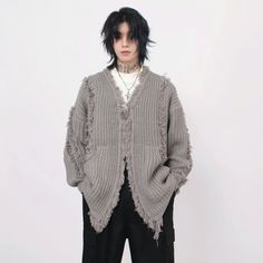 Revamp your wardrobe with the ultimate off-duty piece, our Oversized Distressed Chunky Knit Cardigan. This cardigan is a seamless blend of comfort and rugged style. Crafted from a cozy knit fabric, it boasts a distinctive distressed texture that adds an effortlessly cool edge to any outfit. Its V-neckline and relaxed shape ensure easy layering, making it a must-have for any casual occasion. Pair it with slim jeans and boots for a laid-back look, or throw it over a crisp shirt and trousers for an unexpected twist on workwear. This versatile cardigan is designed to carry you through seasons and settings with ease. Product specifications: Material: 100% Polyester Fit: Oversized loose fit Pattern: Solid color with distressed detailing Closure: Open front for easy wear Sleeve Length: Long sleev Oversized Distressed Winter Sweater, Oversized Distressed Sweater For Winter, Distressed Sweater For Fall Layering, Distressed Sweater For Winter Layering, Fringe Cardigan, Distressed Texture, Rugged Style, Chunky Knit Cardigan, Cozy Knit