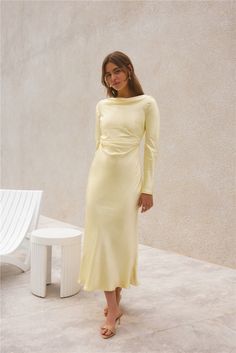 The Forget Me Not Satin Maxi Dress in Butter combines timeless elegance with modern flair, perfect for garden weddings in the English countryside or sophisticated soirées in a Tuscan villa. Embrace the romance of summer with this enchanting dress, designed to leave a lasting impression. Maxi dress, true to size Long sleeves High neck Tie back  Cowl back Invisible side zip Unlined 100% Polyester Non-stretch material  Please refer to the care label on garment for specific instructions on how to care for it Model wears XS Length from shoulder to hem: 135cm on an S Chest 37cm, Waist 30cm, size S Spring Break Dress, Enchanting Dress, Pranali Rathod, Flowy Dresses, Tuscan Villa, Cocktail Dress Formal, Garden Weddings, Travel Outfits, Runway Trends