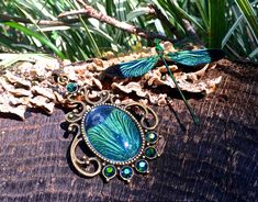 "This amazing real dragonfly necklace is handcrafted from a set of REAL Indonesian Green Damselfly wings (Scientific name: Neurobasis Chinensis)! (read below for more on how I ethically obtain the wings!). The butterfly wing is set in your choice of an antique gold (as pictured), silver, or gunmetal vintage style setting with iridescent green Swarovski crystals. Your choice of chain length (18\" short or 30\" long) with upgrades to Sterling silver available with the silver pendant option. The pe Adjustable Wing-shaped Jewelry For Gifts, Adjustable Wing-shaped Jewelry Gift, Elegant Green Dragonfly Shaped Jewelry, Elegant Adjustable Wing-shaped Jewelry, Handmade Green Dragonfly Jewelry, Elegant Dragonfly Jewelry For Jewelry Making, Handmade Gold Dragonfly Jewelry, Spiritual Dragonfly Jewelry Gift, Green Dragonfly Jewelry For Gifts