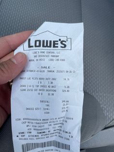 a person holding a receipt in their hand