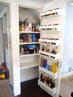 an open pantry with lots of food in it