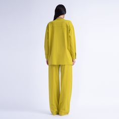 Introducing our chic ensemble: an oversized shirt and wide-leg trousers. The shirt features a front button fastening, long sleeves and flap pockets. The trousers boast a button and zip fastening, a waistband and stylish topstitching, with added convenience from side pockets. Composition: 95% Viscose, 5% Elastane  Dry clean only Chic Long Sleeve Sets With Pockets, Fall Workwear Sets With Wide-leg Pants, Oversized Wide Leg Pants For Fall Workwear, Chic Long Sleeve Pantsuit With Pockets, Chic Long Sleeve Sets For Workwear, Chic Oversized Wide Leg Pants, Chic Oversized Wide Leg Pants For Fall, Green Long Sleeve Pantsuit With Pockets, Modern Long Sleeve Pantsuit For Work