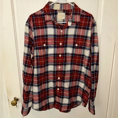 American Eagle Flannel Shirt Size Large In The Colors White, Red, And Blue. Can Fit Sizes Small-Smaller Xl. Was Originally In The Women’s Section But Could Fit To Be A Smaller Men’s Flannel As Well. This Flannel Is Very Flattering And Comfortable To Wear. There Is A Small Spot On The Inside Of The Back Of The Neck (Picture 4) Where There Is Slight Discoloration, It’s Barely Noticeable. Was Bought Brand New For $45 And Only Worn A Couple Of Times. In Great Condition With No Stains, Smells, Rips, Red Relaxed Fit Flannel Shirt, Red Flannel Top For Fall, Red Flannel Long Sleeve Top, Casual Red Flannel Shirt, Red Long Sleeve Flannel Shirt, Red Cotton Flannel Long Sleeve Shirt, Casual Red Cotton Flannel Shirt, Red Cotton Casual Flannel Shirt, Red Casual Flannel Shirt For Fall