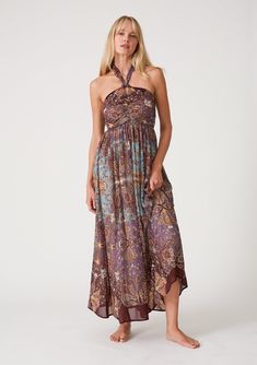 [Color: Raisin/Teal] A front facing image of a blonde model wearing a bohemian halter maxi dress in a multi colored purple and teal floral print. With a tie neckline Spring Maxi Dress, Printed Halter Dress, Purple Paisley, Floral Print Chiffon, Halter Maxi Dress, Ruched Top, Bohemian Floral, Halter Maxi, Vintage Maxi Dress