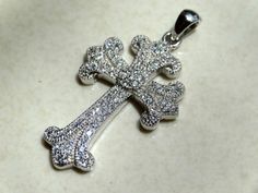 "Sterling silver and cubic zirconia cross pendant. This cross is just so soft and elegant. Pictures can't capture its beauty. 1 3/8\" pendant Clearance" Elegant Pictures, Expensive Jewelry Luxury, Jewelry Luxury, Expensive Jewelry, Feb 8, Miami Fl, Cross Pendant, Pendant Necklaces, Cubic Zirconia