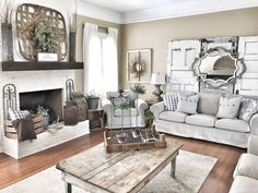 a living room filled with furniture and a fire place