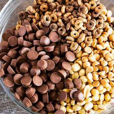 a bowl filled with cereal and nuts on top of a wooden table