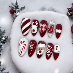 Christmas nails design, red and white color -Nail length : medium -Shape : almond -Nail finishes : glossy The package contains: -10 nails in multiple sizes to fit petite, average, and large nail beds -24 glue tabs + nail glue -Mini nail file + alcohol pads -Mini cuticle pusher stick Christmas Nail Designs Red And White, Reindeer Nails Designs, New Year Nails Design 2024, Colorful Christmas Nails, Christmas Nails Santa, Santa Claus Nails, Nails Design Red, Red And White Christmas Nails, Christmassy Nails