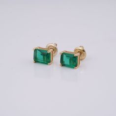 Emerald Earrings , Emerald Shape Earrings, Green Earrings, Gemstone Earrings , Minimalist Diamond Stud Earrings, Anniversary Gift for her 1. These stunning Emerald Stud Earrings, created in 14K Yellow Gold, will elevate your jewelry collection. The gorgeous Emerald Shape jewels have an alluring and sophisticated rich green color that makes them the ideal accent for any setting. 2. The basic style of these green earrings includes a single diamond accent on each stud for a sophisticated and sparkl Minimalist Green Gold-plated Earrings, Classic Everyday Earrings For May Birthstone, Green Single Earring In 14k Gold, Green 14k Gold Hypoallergenic Earrings, Everyday Green 14k Gold Earrings, Classic Gold Emerald Earrings, Classic Single Green Earring, Hypoallergenic 14k Gold Green Earrings, Classic Green Single Earring